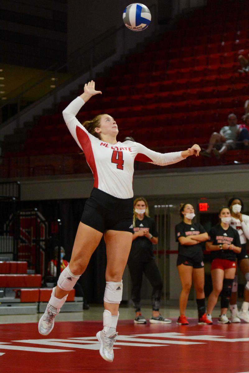 Junior setter Hannah Reid serves the ball during the NC State versus Georgia game on Thursday, Sep. 16, 2021 in Reynolds Coliseum. The Wolfpack beat the Bulldogs 3-1.