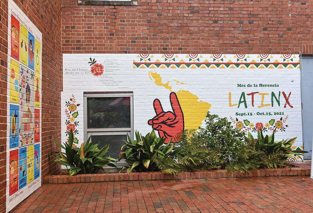 The Latinx mural is revealed on the side of Nelson Hall on Friday, Sept. 17, 2021.&#160;The designer, Bryant Parroquin who is a graduate of UNC, explains "I was excited to introduce my culture and the Latino culture in this design."