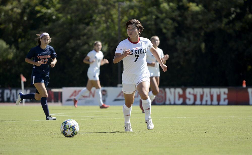 Freshman midfielder Emika Kawagishi prepares to kick the ball on Sunday, Sept. 26, 2021 at Dail Soccer Field. NC State lost to Virginia with a final score of 2-1.