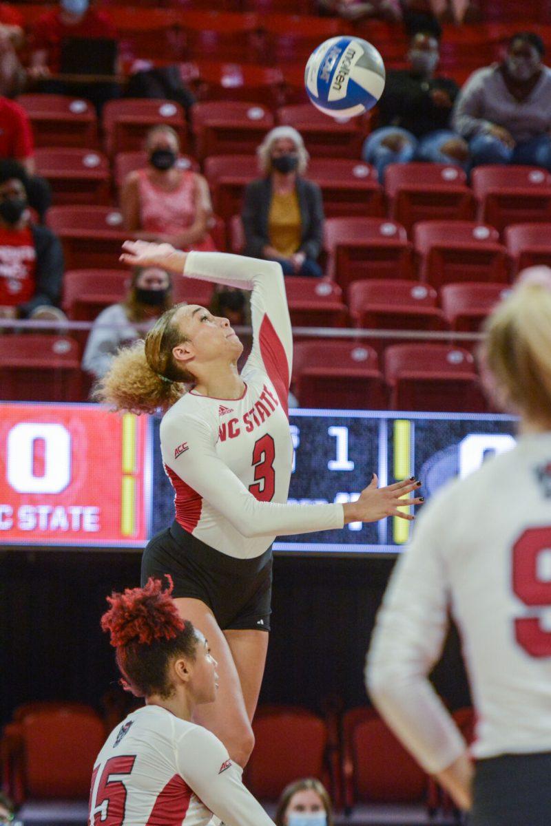 Graduate Melissa Evans spikes the ball to the Georgia Bulldogs during NC State's game on Thursday, Sept. 16, 2021 in Reynolds Coliseum. Evans had 14 kills during the 3-1 win over the Bulldogs.