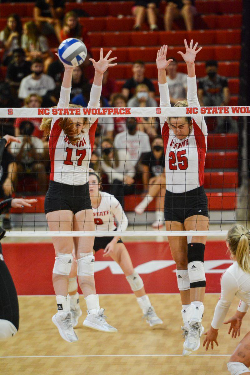 Freshman opposite hitter Amanda Rice and sophomore middle blocker Riley Shaak block a spike attempt by Georgia at the NC State versus Georgia game on Thursday, Sep. 16, 2021 in Reynolds Coliseum. The Wolfpack had 9 blocks against Georgia. The Wolfpack beat the Bulldogs 3-1.