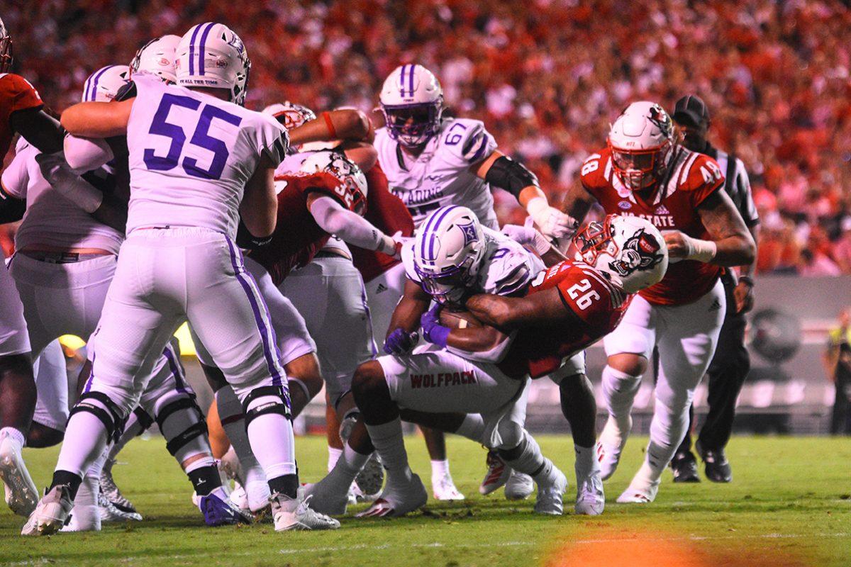 Freshman linebacker Devon Betty tackles a Furman player in the game on Saturday, Sept. 18, 2021. in Carter-Finley Stadium. Betty had 7 total tackles. The Wolfpack beat the Paladins 45-7.