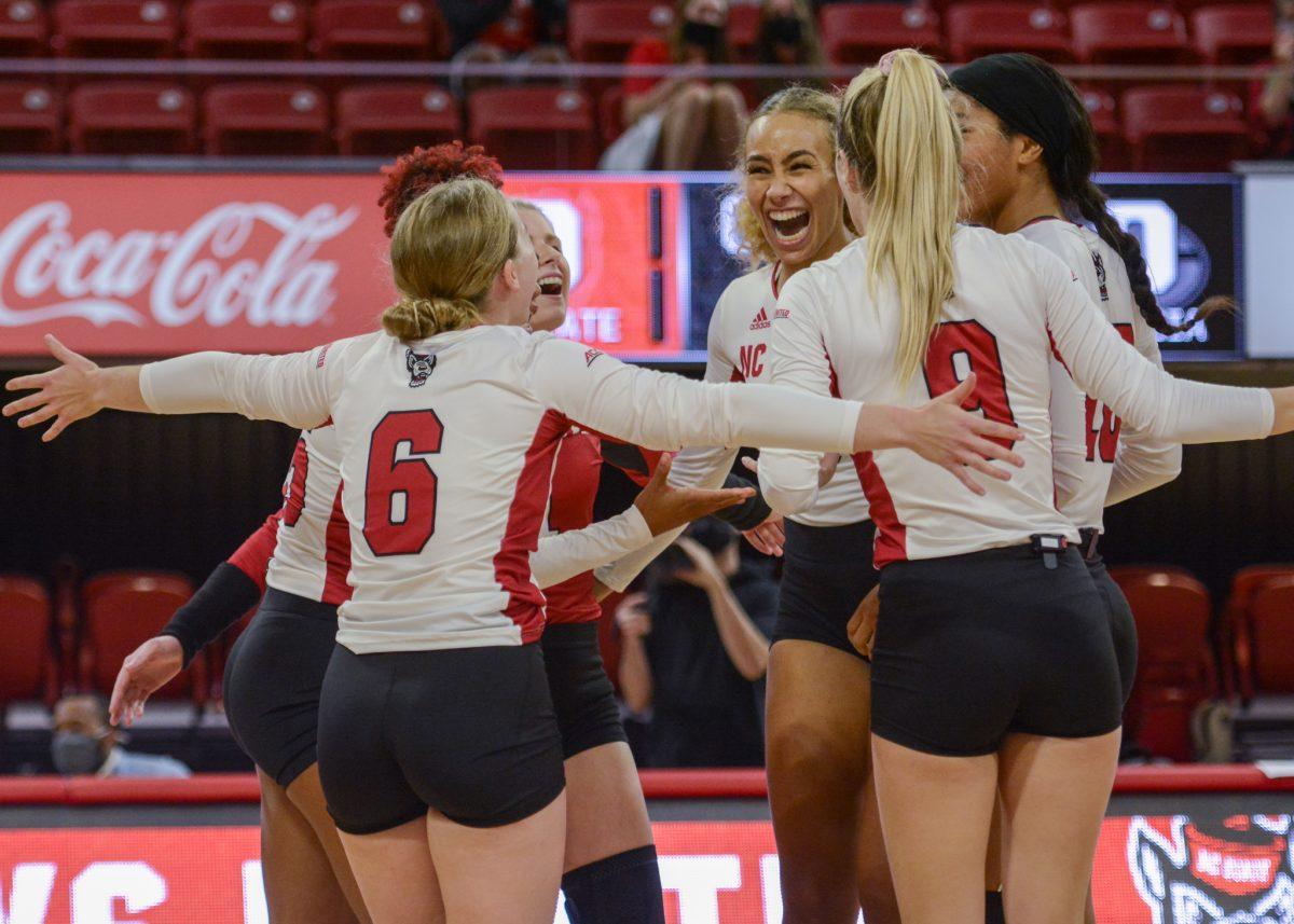 Graduate opposite hitter Melissa Evans celebrates with her team during NC State's game against the Georgia Bulldogs on Thursday, Sept. 16, 2021 in Reynolds Coliseum. Evans had 14 kills during the 3-1 win over the Bulldogs.