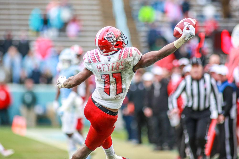 Redshirt junior wide receiver Jakobi Meyers gets a hand on the ball to bring down an acrobatic catch on the side lines. Meyers had 111 yards on seven receptions during the 34-28 overtime win over UNC on Saturday, Nov. 24 in Kenan Memorail Stadium.