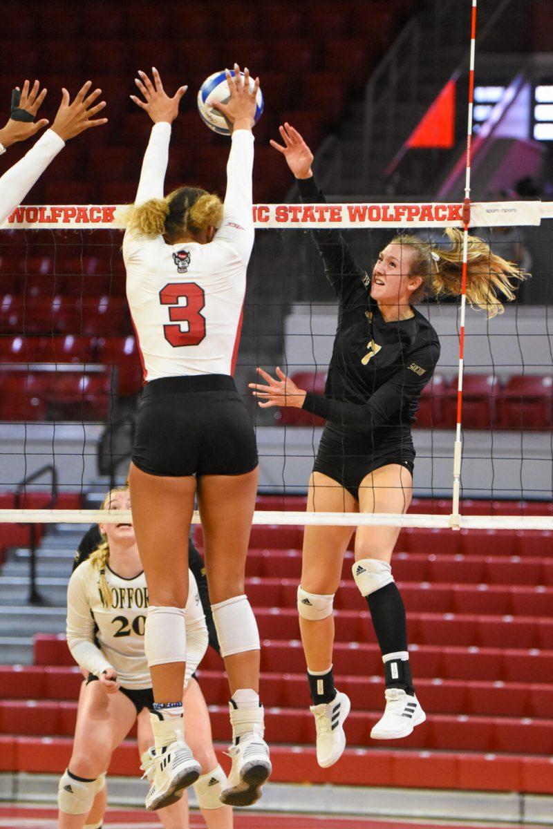 Graduate Student opposite hitter Melissa Evans blocks a Wofford spike attempt during the game against the Wofford Terriers on Friday, Sep. 3, 2021 in Reynolds Coliseum. Evans had 10 kills against the Terriers. NC State beat Wofford 3-0.