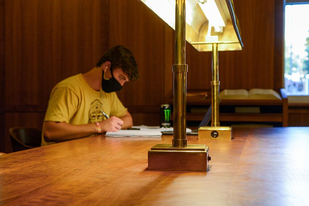 Blake Albright, second-year studying biology human bio concentration, does his homework in the back room at D.H. Hill Library on Thursday, Aug. 20, 2020.