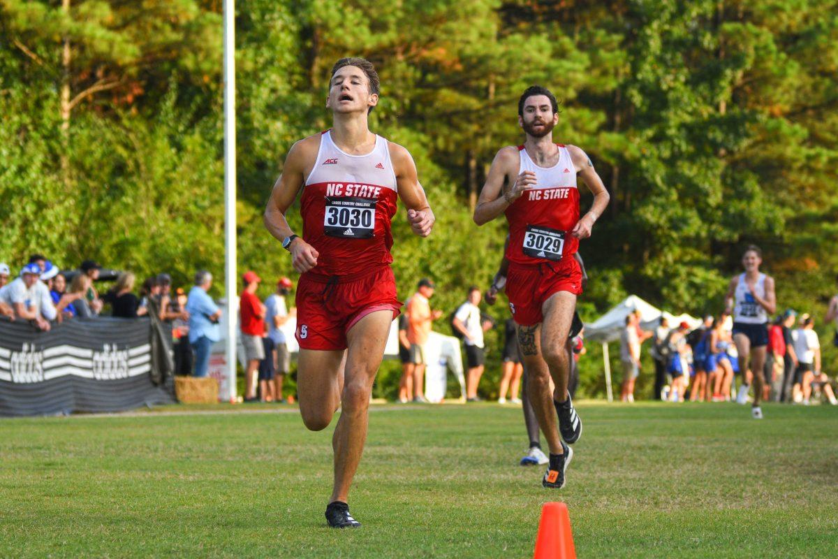 Sophomore Brett Garner runs to the finish line with graduate student JP Flavin right behind him in the Adidas XC Challenge on Friday, Sept. 17, 2021 at Wake Med Soccer Park. Gardner finished third place, and Flavin finished fourth. In the men's division, the Wolfpack placed second.