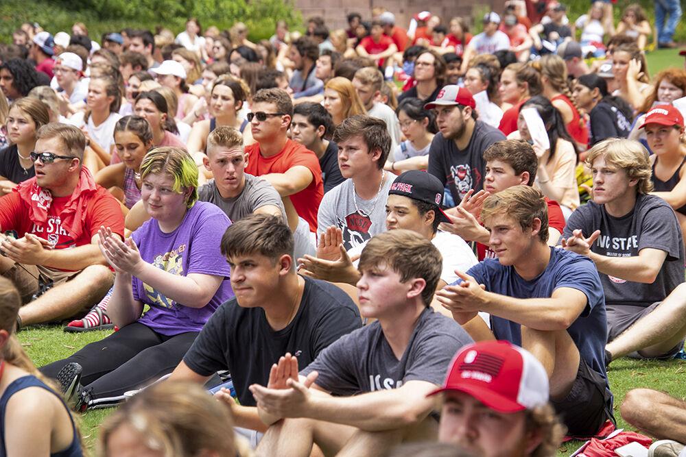 NC State freshmen clap as Chancellor Randy Woodson finishes his speech to new students at the Freshmen Convocation Aug. 15, 2021 in Court of the Carolina.