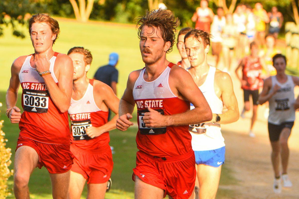 Redshirt junior Nate Kawalec and graduate student Robinson Snider run side-by-side in the Adidas XC Challenge at Wake Med Soccer Park on Friday, Sept. 17, 2021. The Wolfpack men's XC team placed second overall.