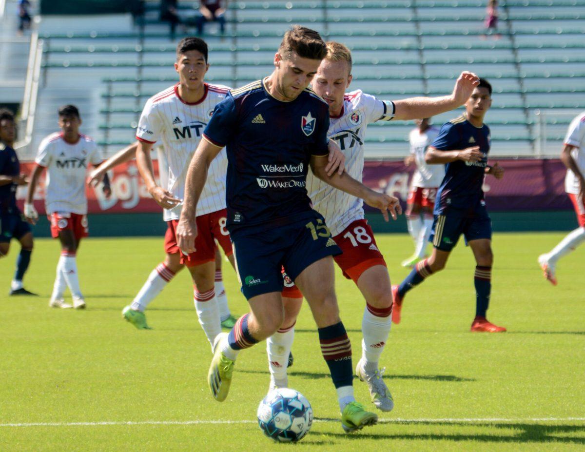 North Carolina FC midfielder Dan Steedman attempts to maintain possession against North Texas SC during the game on Saturday, Sept. 26, 2021 in Sahlen's Stadium at WakeMed Soccer Park. NCFC lost to North Texas SC 1-0.