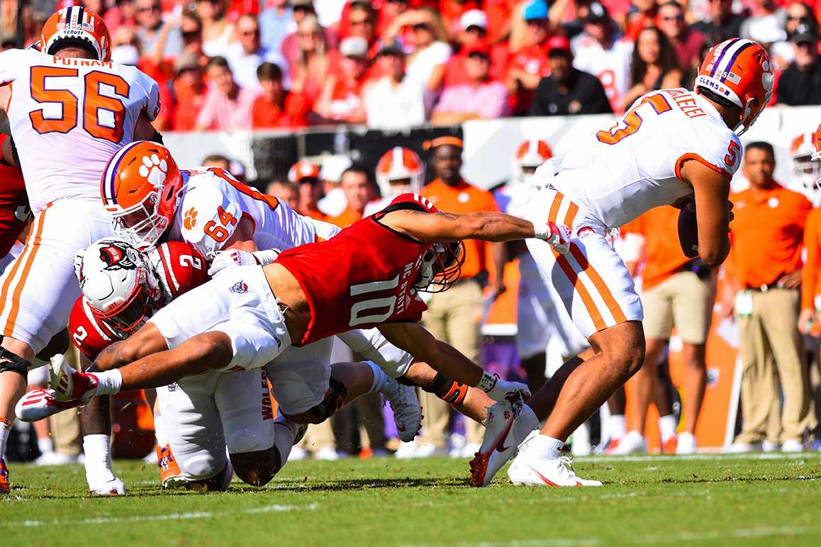 Junior safety Tanner Ingle goes to tackle Clemson quarterback DJ Uiagalelei during the game Saturday, Sept. 25, 2021 in Carter-Finley Stadium.&#160;Ingle had a total of seven tackles. The Wolfpack beat the Tigers 27-21 in double overtime.&#160;