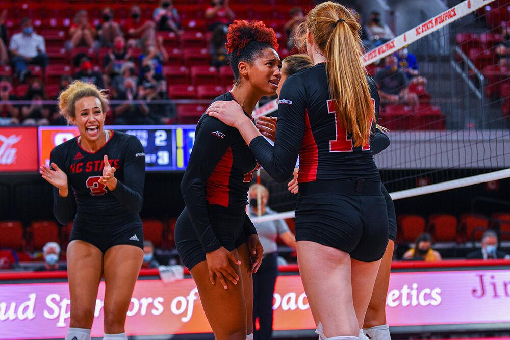 Freshman outside hitter Amanda Rice and senior outside hitter Jade Parchment celebrate their point as they scored during the match against Pitt on Sept. 26, 2021 at William Neal Reynolds Coliseum. The Pack lost 3-0 against the Panthers.&#160;