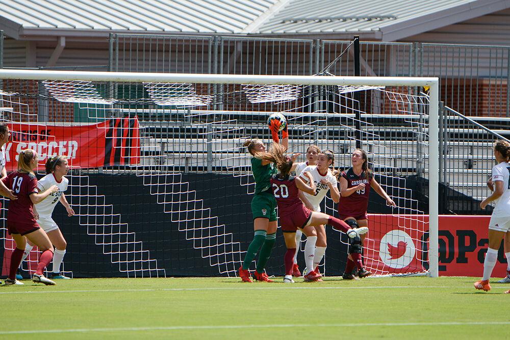NC State freshman goalkeeper Maria Echezarreta (19) catches a ball from a corner kick during the NC State Wolfpack's game against the South Carolina Gamecocks at Dail Soccer Field on Saturday, August 29, 2021. The Wolfpack lost the match 2-1 on a last-minute score by the Gamecocks.