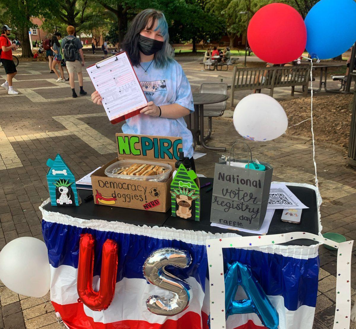 Abby Cornett is pictured at NCPIRG's outreach event in the Brickyard on Sept. 28, 2021.