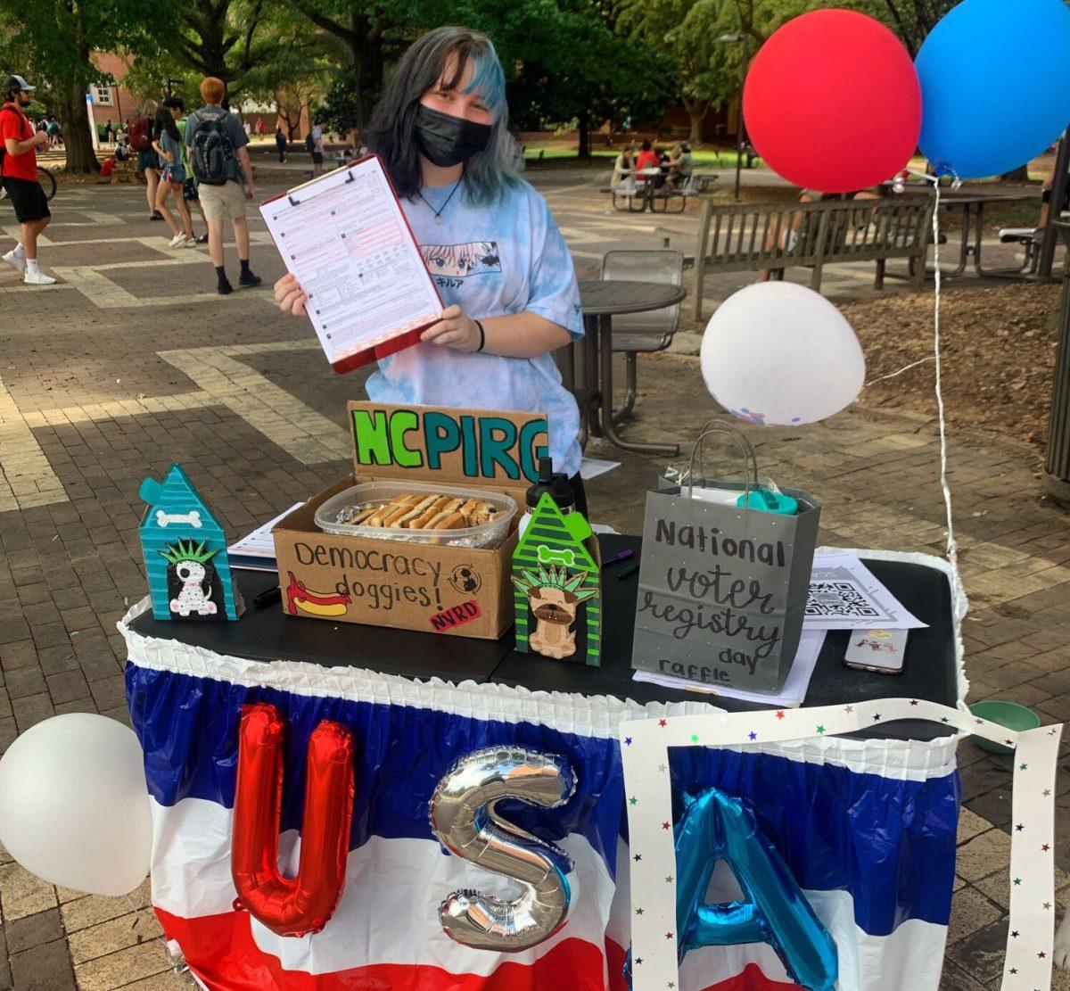 Abby Cornett is pictured at NCPIRG's outreach event in the Brickyard on Sept. 28, 2021.