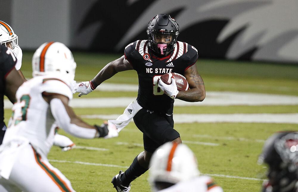 N.C. State running back Ricky Person Jr. (8) gains yards during the first half of N.C. State&#8217;s game against Miami at Carter-Finley Stadium in Raleigh, N.C., Friday, Nov. 6, 2020.