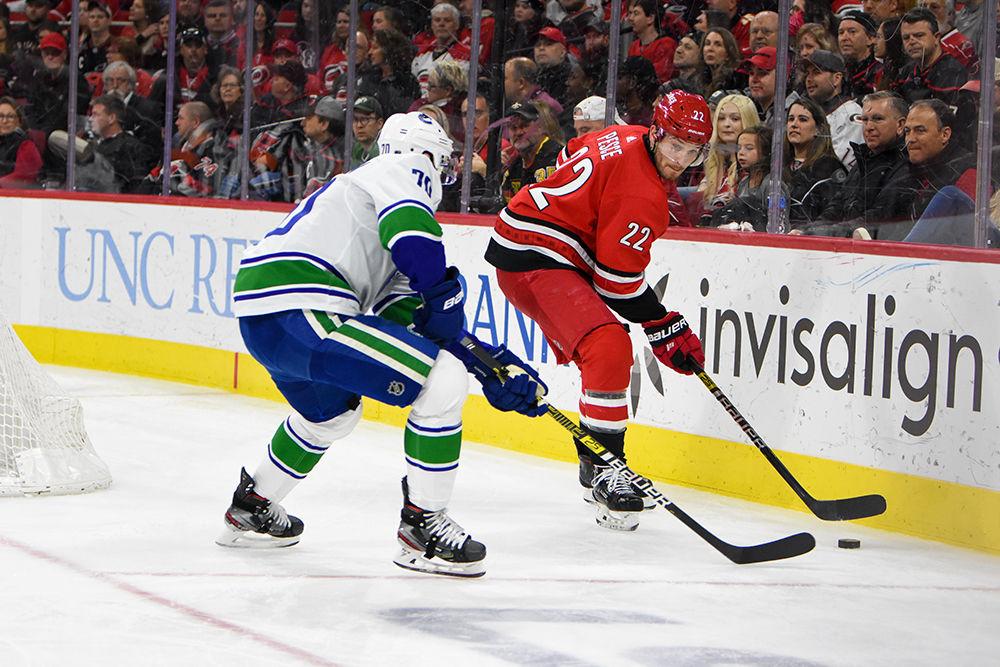 Carolina Hurricanes defenseman Brett Pesce skates along the boards during the game versus the Vancouver Canucks on Sunday, Feb. 2, 2020 in PNC Arena. The Hurricanes won the shootout to beat the Canucks 4-3.