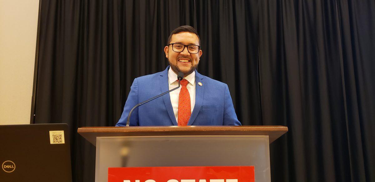 Rep. Ricky Hurtado standing at a podium in the&#160;Currituck-Hatteras Ballroom in Talley Student Union&#160;on Thursday, Oct. 7, 2021.