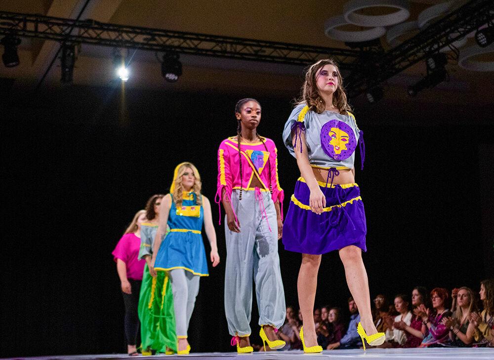 Fourth year design studies student Sara Bailey's models wearing her entire collection walks down the walk way during the Art2Wear rehearsal on Friday, April 26, 2019 at Talley Student Union. Bailey's collection is called "Pop!" which is made out of upcycled 100% cotton knits.