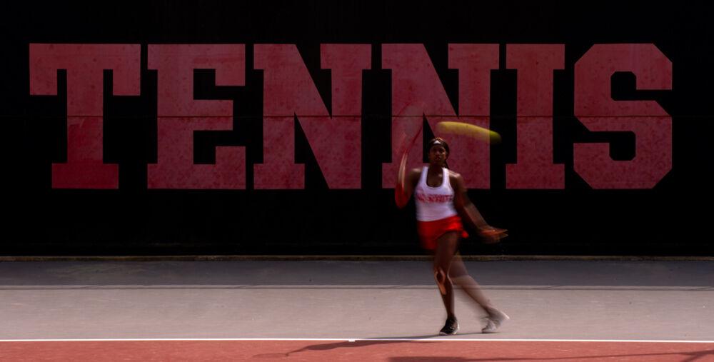 Junior Alana Smith returns the ball against No. 12 Virginia on Sunday, April 11, 2021 at J.W. Isenhour Tennis Center. Smith&#8217;s doubles match with fifth-year Anna Rogers went unfinished and Smith lost her singles match 3-6, 6-2, 7-5 as the Wolfpack won 4-3.