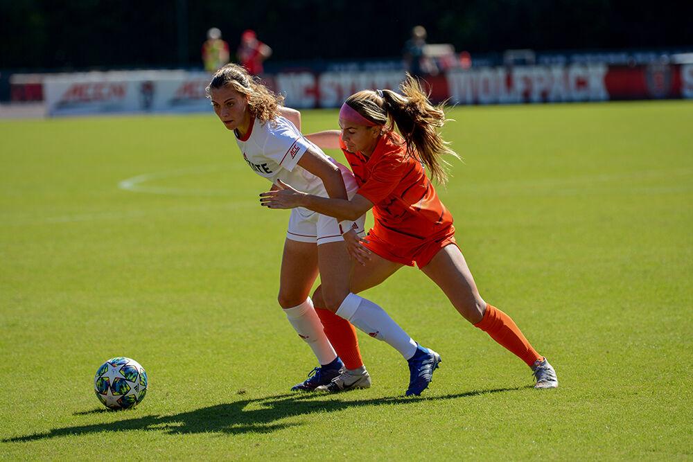 Freshman midfielder Annika Wohner keeps control of the ball in the game versus Syracuse on Sunday, Oct. 24, 2021 at Dail Soccer Field. Wohner had one shot and one shot on goal during the game. NC State beat Syracuse 3-0.