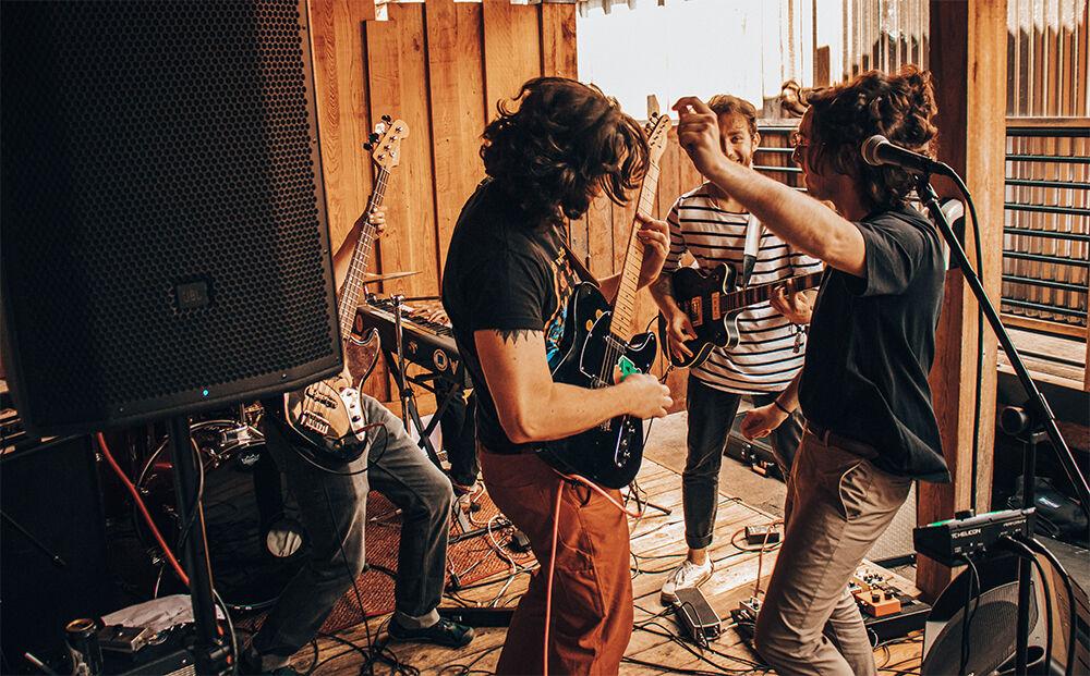 L-R - Marshall Farr on bass (behind speaker), Jack O'Brien (guitar), Andrew Barsody (guitar in back), Alec O'Brien (vocals, dancing)