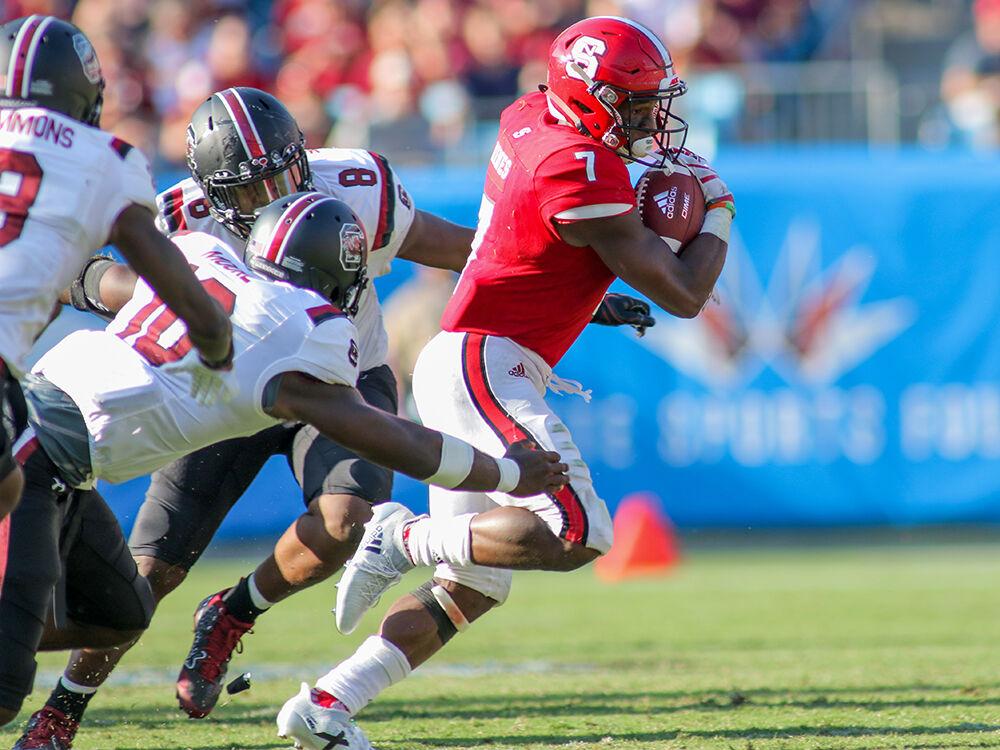 Junior running back Nyheim Hines breaks away from the South Carolina defense. Hines had a team high 83 yards on 15 carries during the 35-28 loss to South Carolina on Saturday Sept. 2, 2017 in the Bank of America Stadium for the Belk College Kickoff game.