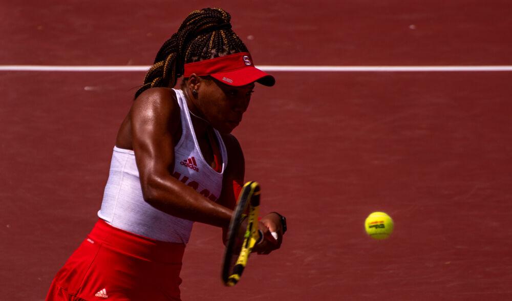Senior Jaeda Daniel returns the ball against No. 12 Virginia on Sunday, April 11, 2021 at J.W. Isenhour Tennis Center. Daniel won her doubles match with fifth-year Adriana Reami 6-1, as well as her singles match 6-3, 6-3. The No. 6 Wolfpack won 4-3.