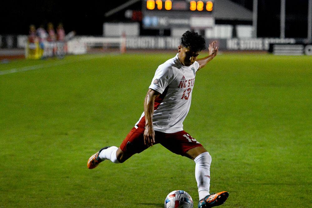 Senior midfielder Alex Hernandez takes a shot in the Wolfpack's game against the Panthers on Tuesday, Oct. 12, 2021 at Dail Soccer Field. Hernandez had one goal in NC State's 4-0 win over High Point.
