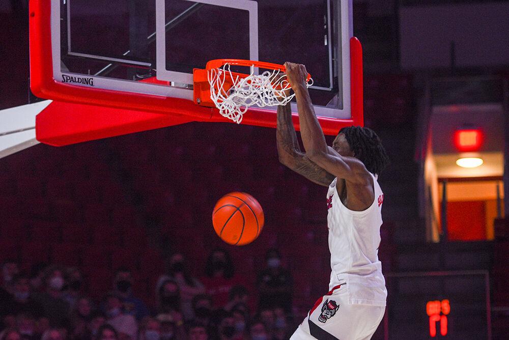 Redshirt Sophomore Guard Dereon Seabron dunks during the dunk competition at Primetime in Reynolds Coliseum on Oct. 14. The event served as a fun way to introduce the Men and Women's basketball teams.