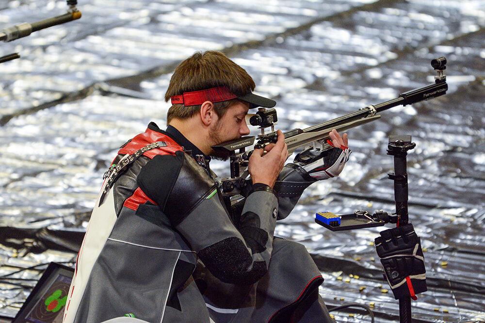 Freshman Samuel Burrow adjusts his rifle in the competition against WVU on Sunday, Oct. 16, 2021 in Reynolds Coliseum. NC State lost to West Virginia 4730-4652.