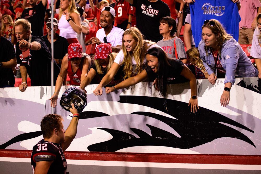 Junior kicker Christopher Dunn greets fans after the win over Louisiana Tech on Saturday, Oct. 2, 2021 at Carter-Finley Stadium. Dunn went 2-2 on field goals and 4-4 on extra points as the Wolfpack won 34-27.