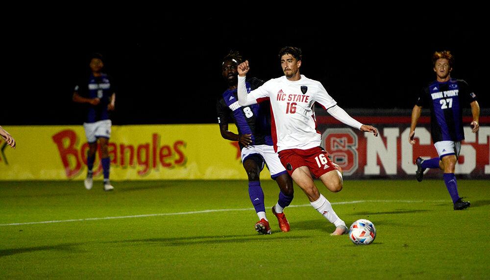 Freshman midfielder Yaniv Bazini crosses the ball in the Wolfpack's game against the Panthers on Tuesday, Oct. 12, 2021 at Dail Soccer Field. Bazini had four shots and one assist in NC State's 4-0 win over High Point.