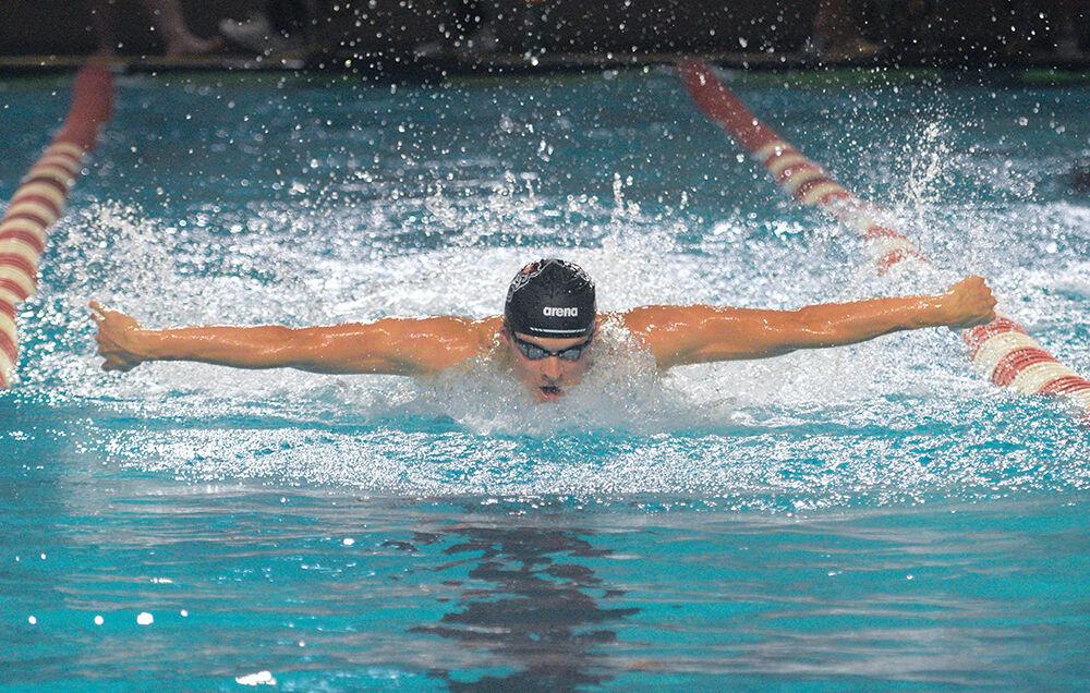 Senior Noah Henderson swims the 100 butterfly during the meet against Tennessee on Friday, Oct. 15, 2021 in the Willis R. Casey Aquatic Center. Henderson placed second in this event with a time of 46.72. The Wolfpack men's team beat the Volunteers 205-95.