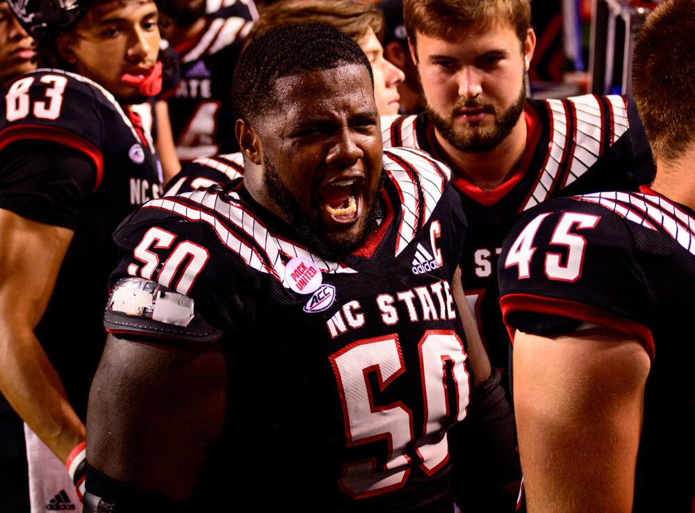 Redshirt junior center Grant Gibson celebrates the win over Louisiana Tech on Saturday, Oct. 2, 2021 at Carter-Finley Stadium. The Wolfpack won 34-27.