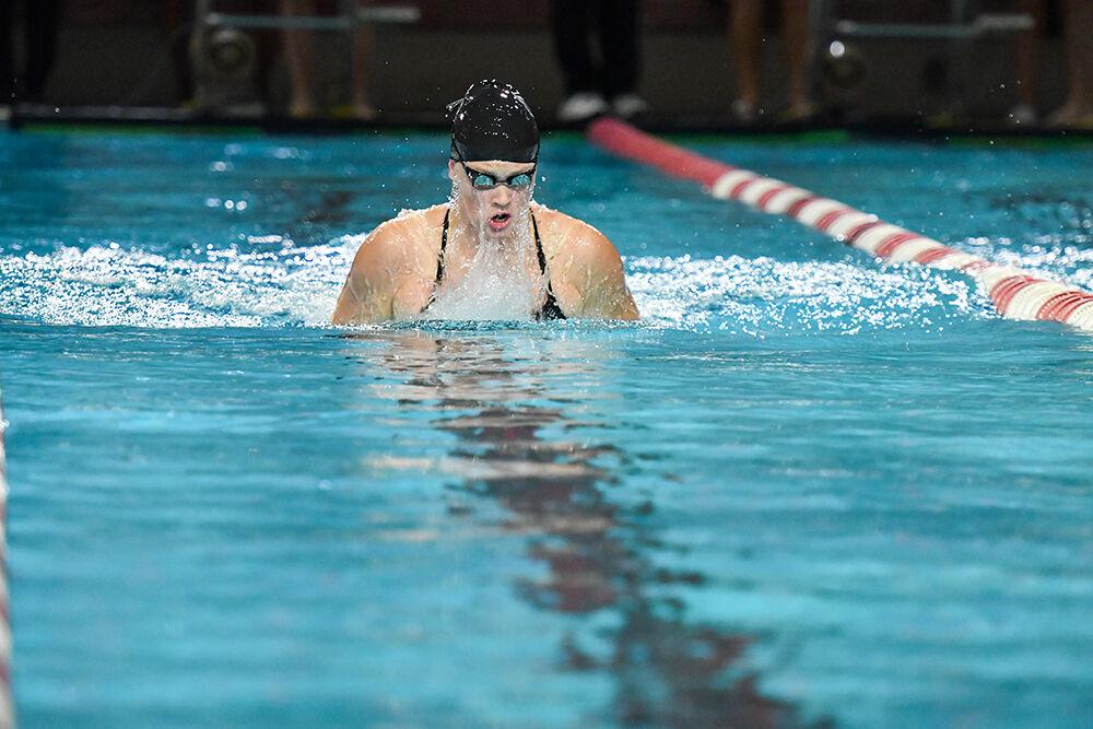 Senior Maddie Smith swims in the women's 200-meter breaststroke on October 16, 2021 at the Willis R. Casey Aquatic Center. Smith finished with a time of 2:22.19.&#160;The Wolfpack women beat the Tennessee Volunteers 182-118.