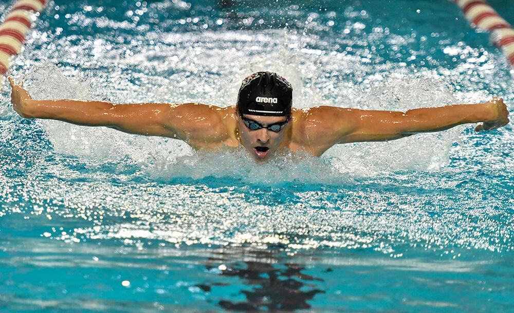 Senior Curtis Wiltsey swims in men's 200-meter fly on October 16, 2021 at the Willis R. Casey Aquatic Center. Wiltsey finished with the time of 1:51.22.&#160;The Wolfpack men beat the Tennessee Volunteers 205-95.