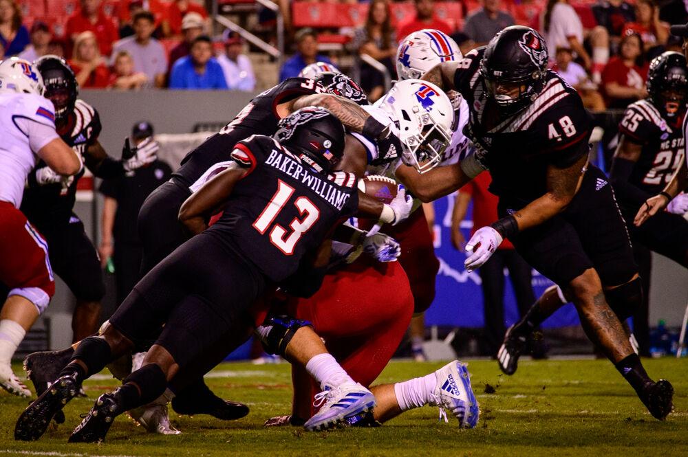 The NC State defense makes a tackle against Louisiana Tech on Saturday, Oct. 2, 2021 at Carter-Finley Stadium. The Wolfpack won 34-27.