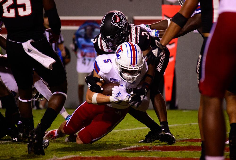 Louisiana Tech wide receiver Griffin Hebert scores against NC State on Saturday, Oct. 2, 2021 at Carter-Finley Stadium. The Wolfpack won 34-27.