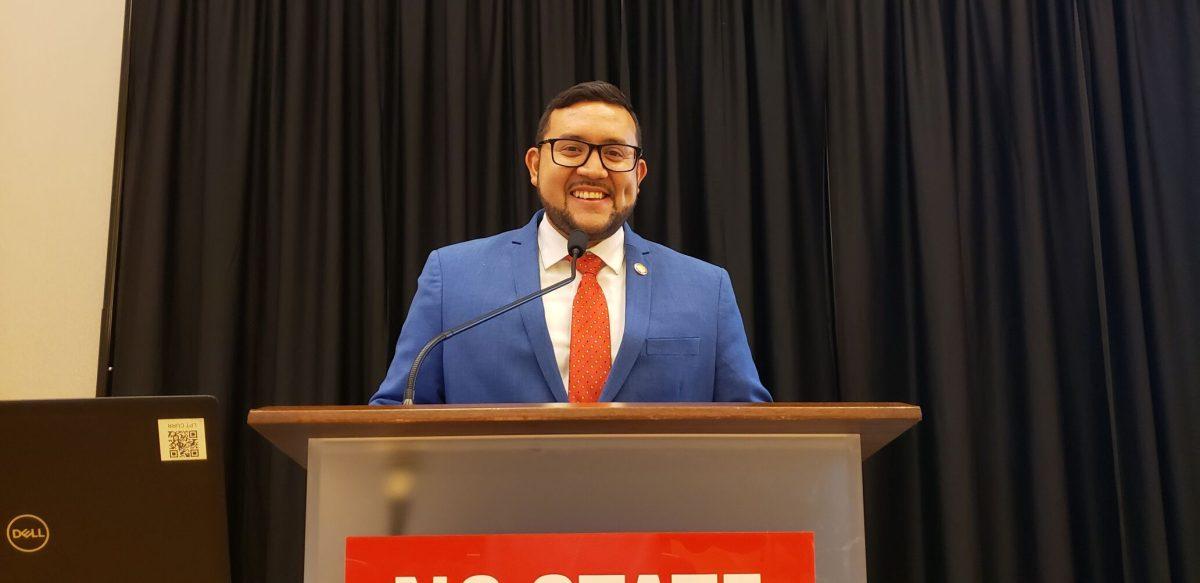 Rep. Ricky Hurtado standing at a podium in the&#160;Currituck-Hatteras Ballroom in Talley Student Union&#160;on Thursday, Oct. 7, 2021.
