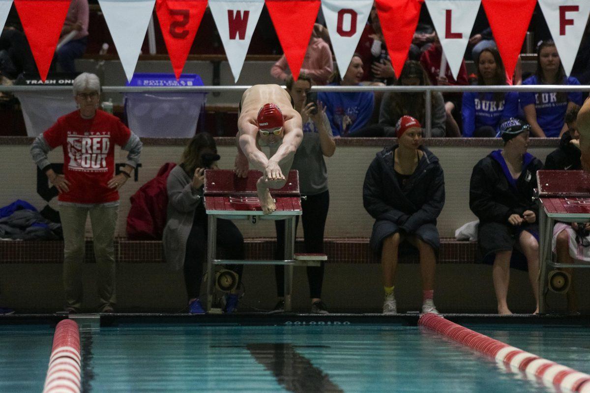 Sophomore Zach Brown leaps off the strating block for the 200 yard butterfly. Brown placed first with a 1:47.51 in the 191-104 rout of Duke on Saturday, Jan. 18 in the Casey Aquatic Center.