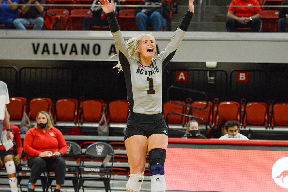 Gradiate libero Kaylee Frazier jumps with joy during NC State's match against Notre Dame on Sunday, Nov. 7, 2021 in Reynolds Coliseum. Frazier had 19 digs against the Irish during the 3-2 Wolfpack win.