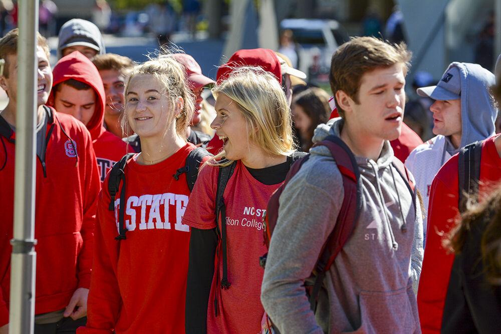 Students waiting in line express different emotions and reactions upon hearing the Wear Red Get Fed booth at Stafford Commons ran out of food on Wednesday, Oct. 27 2021.