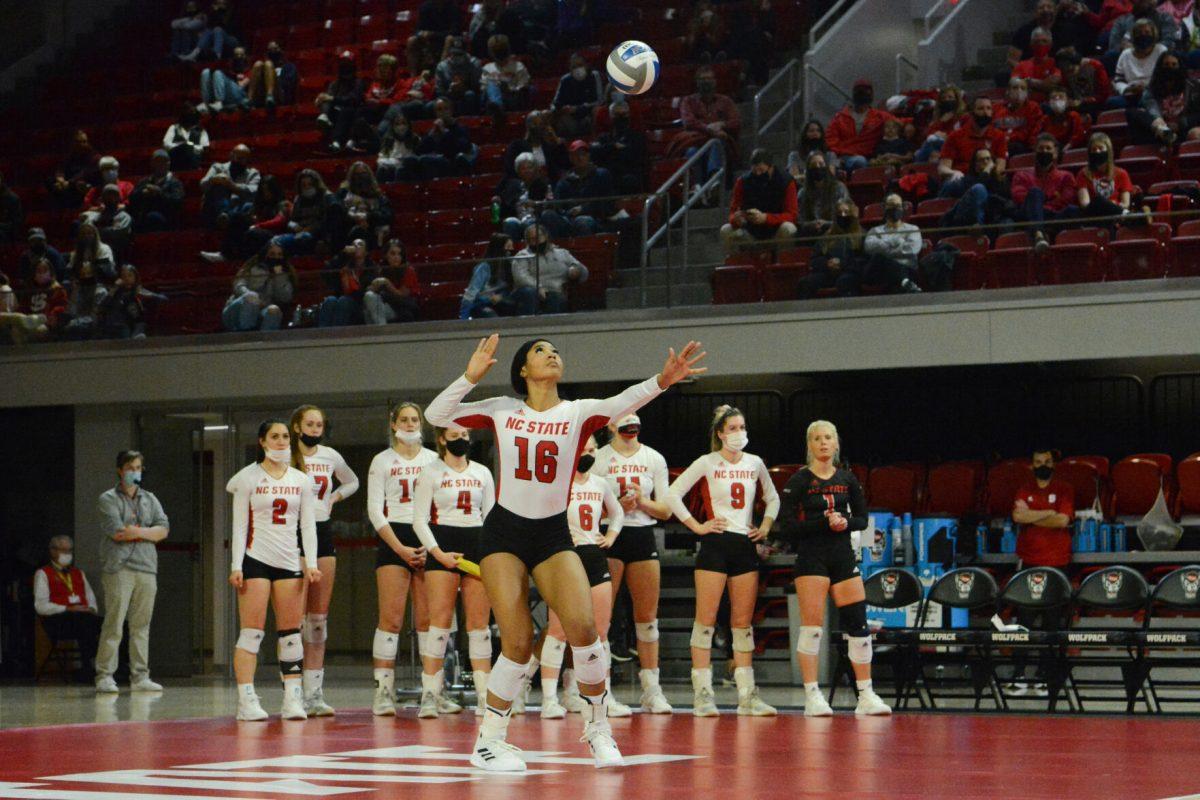 Freshman middle blocker Jada Allen serves the ball to the Louisville Cardinals. Allen had six kills during the game. The Wolfpack lost to the Cardinals with a final score of 3-0.