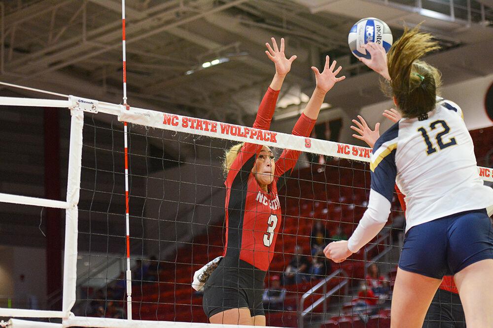 Graduate opposite hitter Melissa Evans looks to block a spike from Notre Dame on Sunday, Nov. 7, 2021 in Reynolds Coliseum. Evans had 6 blocks against Notre Dame. The Wolfpack beat the Fighting Irish 3-2.