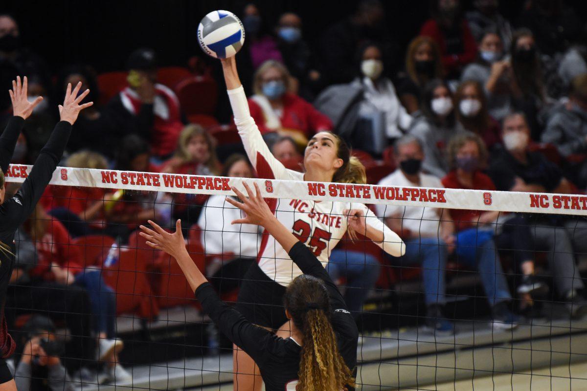 Sophomore middle blocker Riley Shaak spikes the ball in the game against the Louisville Cardinals on Friday, Nov. 5, 2021 in Reynolds Coliseum. Shaak had two kills and six attacks. The Wolfpack lost 3-0.