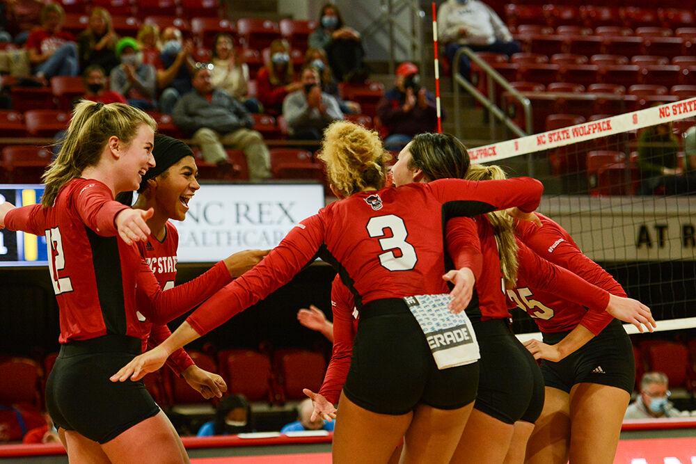 Redshirt junior outside hitter Taylor Rowland and freshman middle blocker Jada Allen celebrate with their team during NC State's match against Notre Dame on Sunday, Nov. 7, 2021 in Reynolds Coliseum. The Wolfpack had 77 kills against the Irish during its 3-2 win.