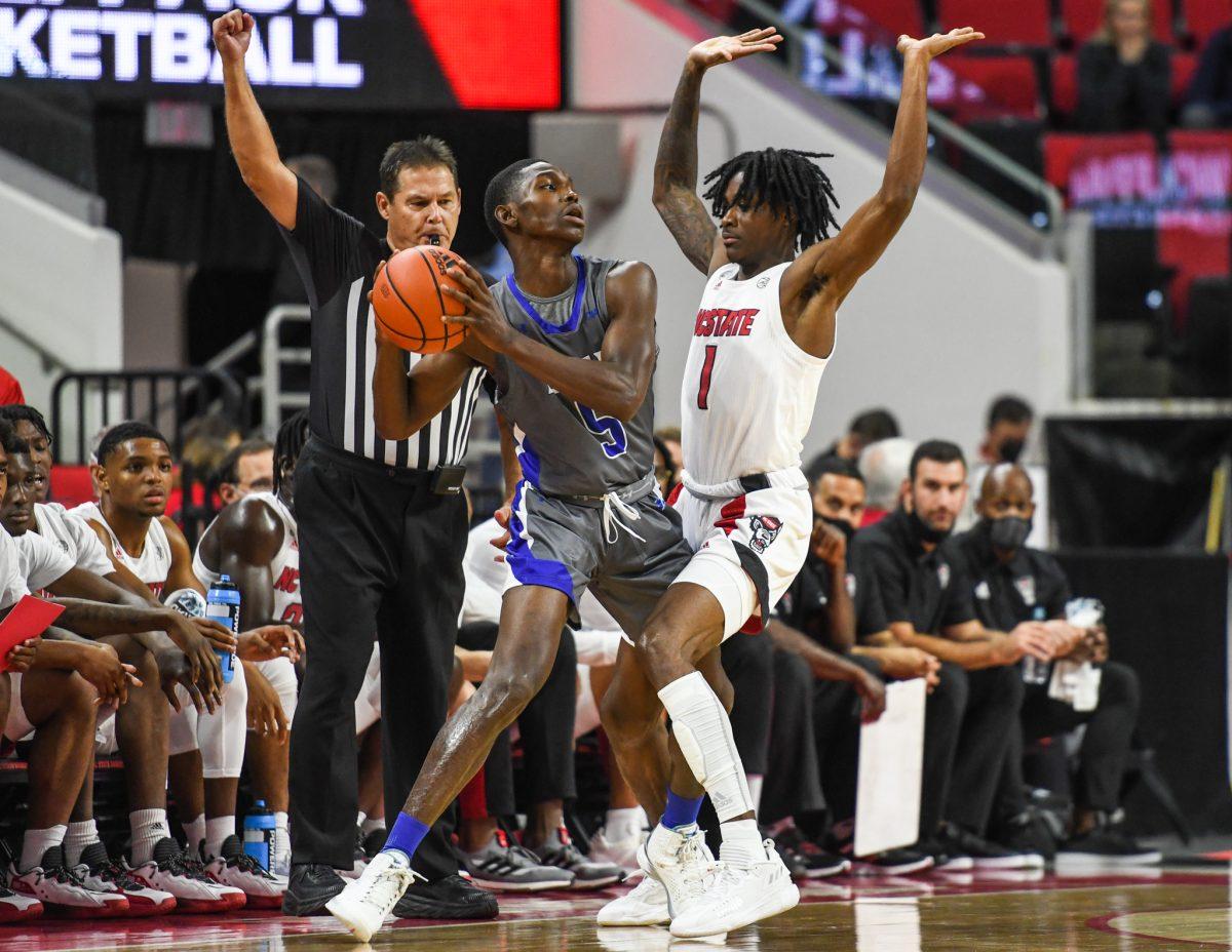 Redshirt sophomore guard Dereon Seabron gets a foul call during the game versus the Elizabeth City State Vikings on Monday, Nov. 1, 2021 in PNC Arena. Seabron scored 10 points and shot 4-6 against Elizabeth City State. The Wolfpack beat the Vikings 87-68.