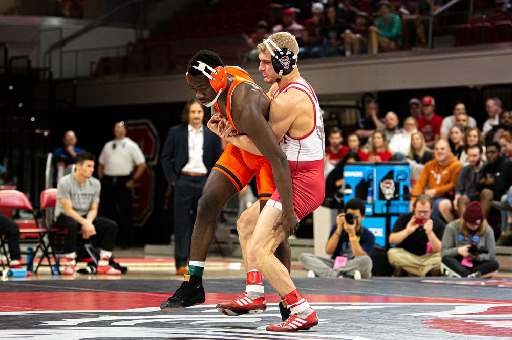 Redshirt junior Hayden Hidlay wrestles Princeton sophomore Quincy Monday on Saturday, Jan. 11, 2020 at Reynolds Coliseum. Hidlay defeated Monday by decision 7-2, helping the Wolfpack to a 29-12 dual win.
