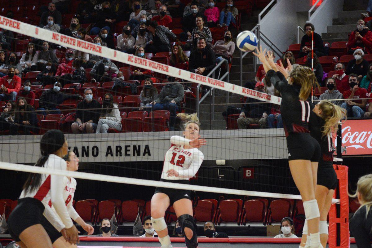 Junior opposite hitter Taylor Rowland prepares to intercept the ball from Louisville on Friday, November 5, 2021 in Reynolds Coliseum. The Louisville Cardinals beat the Wolfpack 3-0.